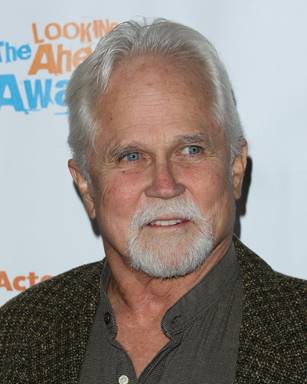 A person with grey hair
Description automatically generated with medium confidence